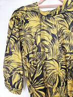 Zwierige gele vintage jurk met zwart patroon | L