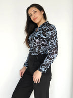 Jaren 70 top lichtblauw met zwarte print | XS